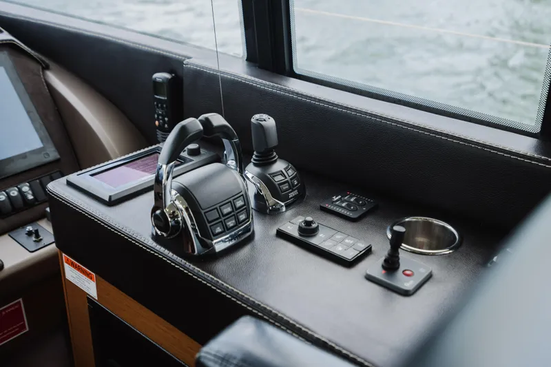 Worldwide Yacht Photos Pics Control panel of a 2014 Prestige 620 Fly yacht, featuring modern navigation equipment.