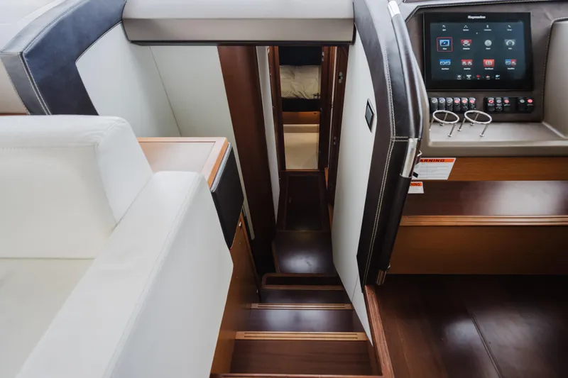 Worldwide Yacht Photos Pics Interior of 2014 Prestige 620 Fly yacht, featuring stairs and control panel.