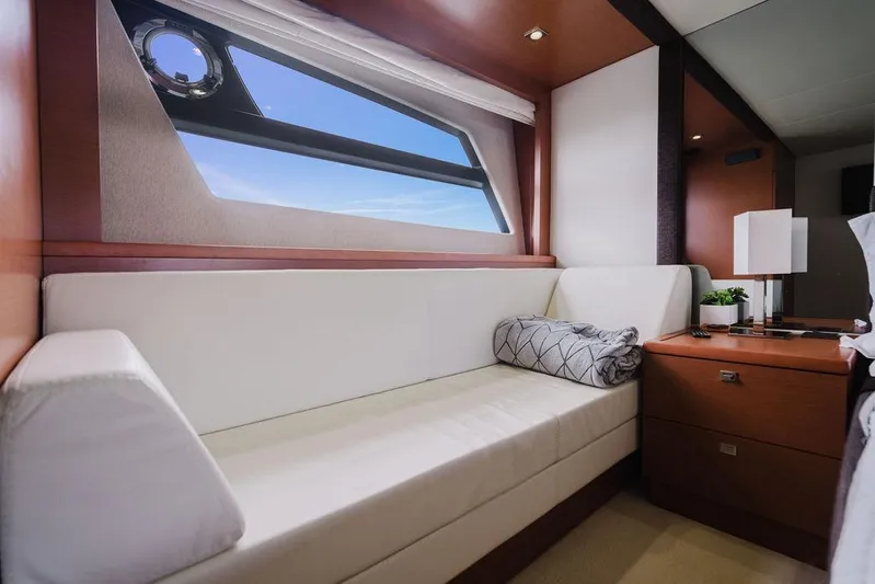 Worldwide Yacht Photos Pics Luxurious interior of 2014 Prestige 620 Fly yacht with elegant seating and window view.