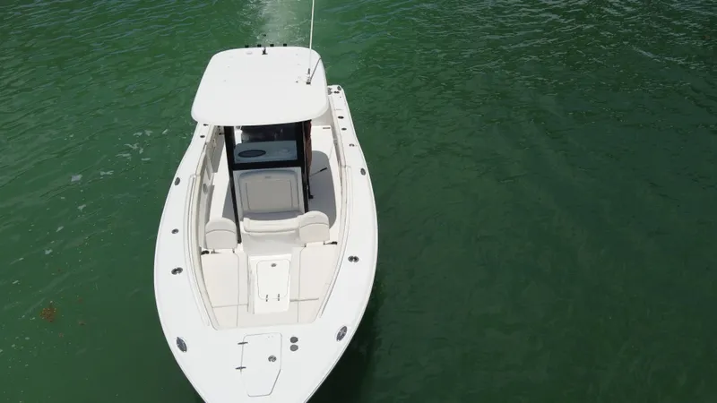  Yacht Photos Pics 2024 Sea Hunt Gamefish 27 Forward Seating boat on calm green water.