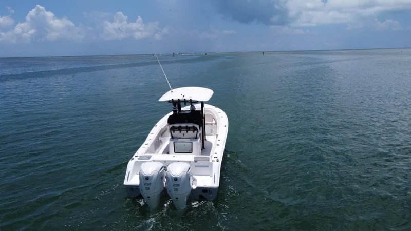  Yacht Photos Pics 2024 Sea Hunt Gamefish 27 boat on open water, featuring dual engines and forward seating.