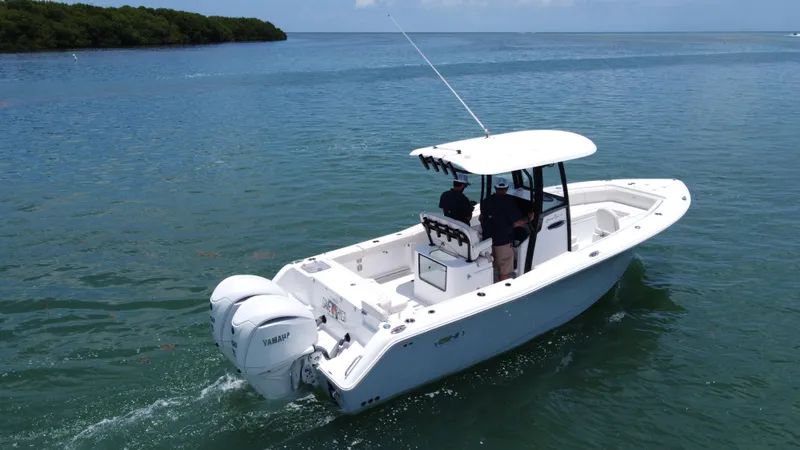  Yacht Photos Pics 2024 Sea Hunt Gamefish 27 boat cruising on calm water with dual Yamaha engines.