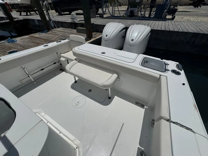  Yacht Photos Pics 2024 Sea Hunt Gamefish 27 boat with forward seating and dual engines at dock.