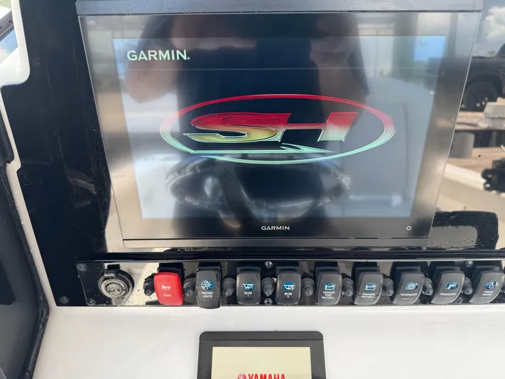  Yacht Photos Pics Garmin display on 2024 Sea Hunt Gamefish 27 boat dashboard with control switches.