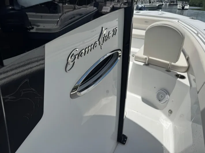  Yacht Photos Pics 2024 Sea Hunt Gamefish 27 Forward Seating boat, close-up of logo and seating area.