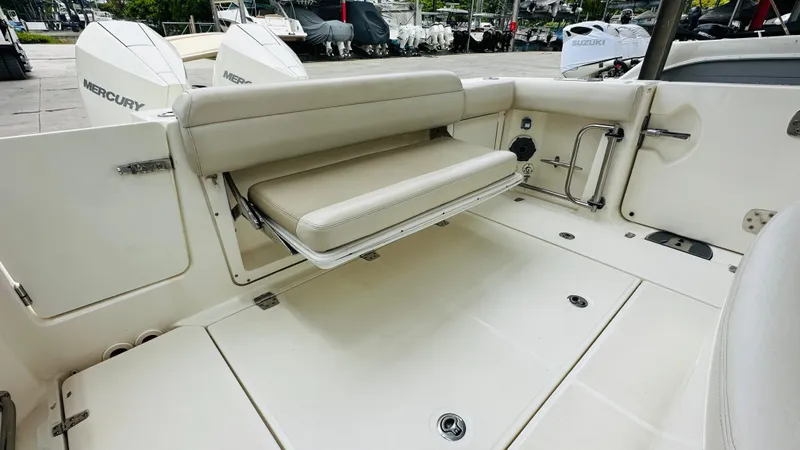  Yacht Photos Pics 2020 Boston Whaler 330 Outrage boat interior with foldable seating and Mercury engines.