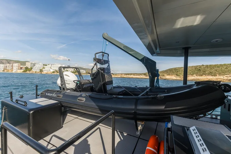 Vanguard Yacht Photos Pics RIB boat on deck of 2023 Naval Yachts XPM 78, coastal backdrop.