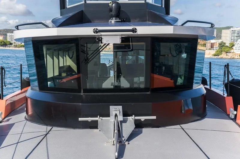 Vanguard Yacht Photos Pics 2023 Naval Yachts XPM 78 yacht, featuring sleek design and modern windows, docked by the sea.