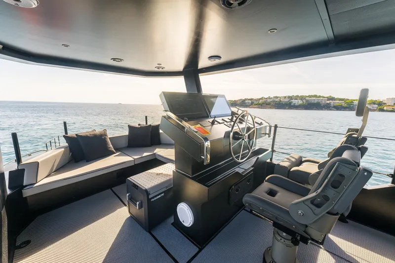 Vanguard Yacht Photos Pics Luxurious 2023 Naval Yachts XPM 78 helm with seating, overlooking serene ocean view.