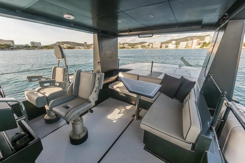 Vanguard Yacht Photos Pics Luxurious 2023 Naval Yachts XPM 78 interior with seating and scenic ocean view.