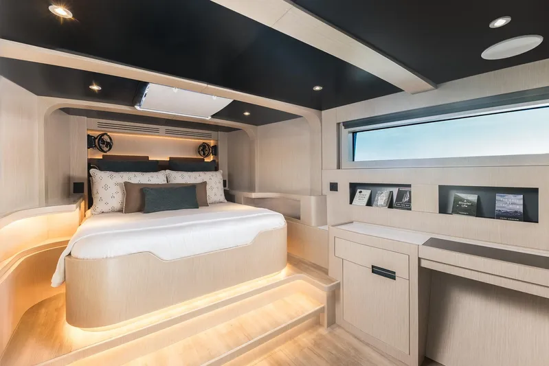 Vanguard Yacht Photos Pics Luxurious bedroom interior of 2023 Naval Yachts XPM 78, featuring modern design and ambient lighting.