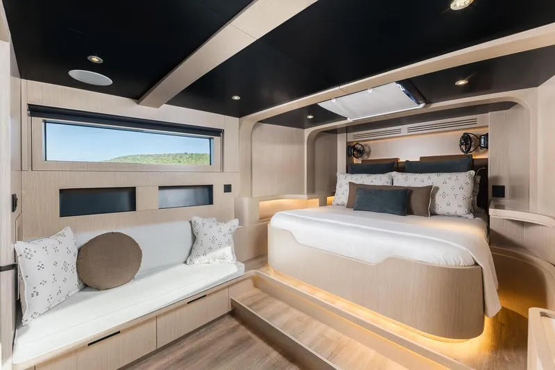 Vanguard Yacht Photos Pics Luxurious bedroom interior of 2023 Naval Yachts XPM 78 with modern design and elegant furnishings.