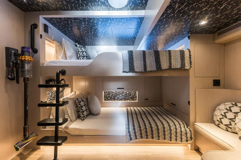 Vanguard Yacht Photos Pics Luxurious interior of 2023 Naval Yachts XPM 78 with modern bunk beds and stylish decor.