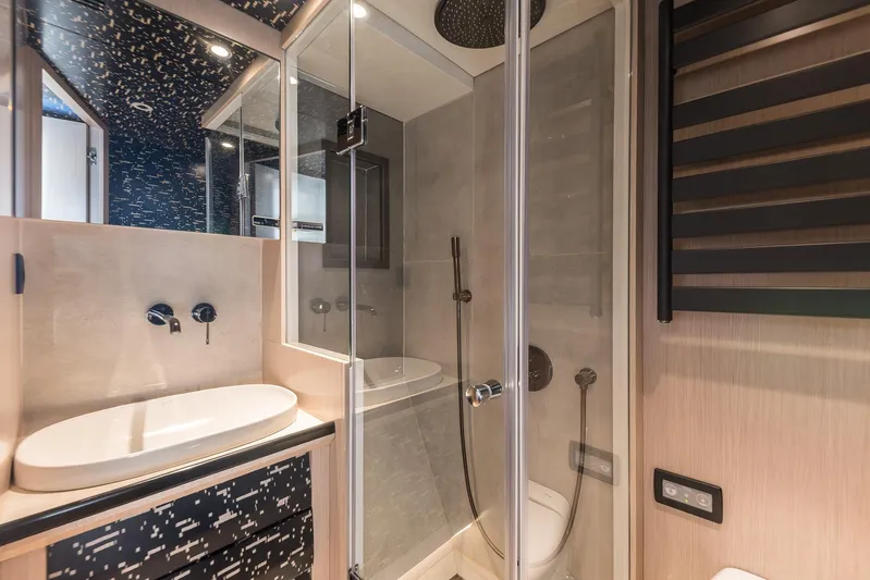 Vanguard Yacht Photos Pics Luxurious bathroom in 2023 Naval Yachts XPM 78 with modern shower and sleek design.