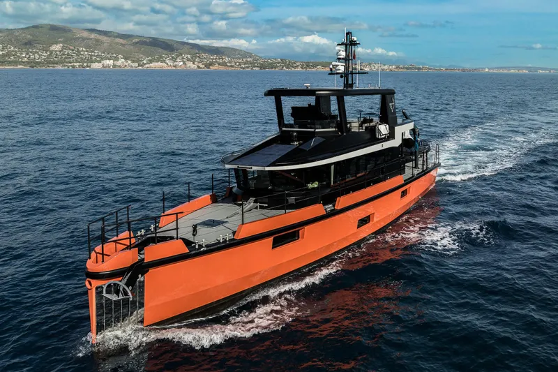 Vanguard Yacht Photos Pics 2023 Naval Yachts XPM 78 cruising on open sea with scenic coastal backdrop.