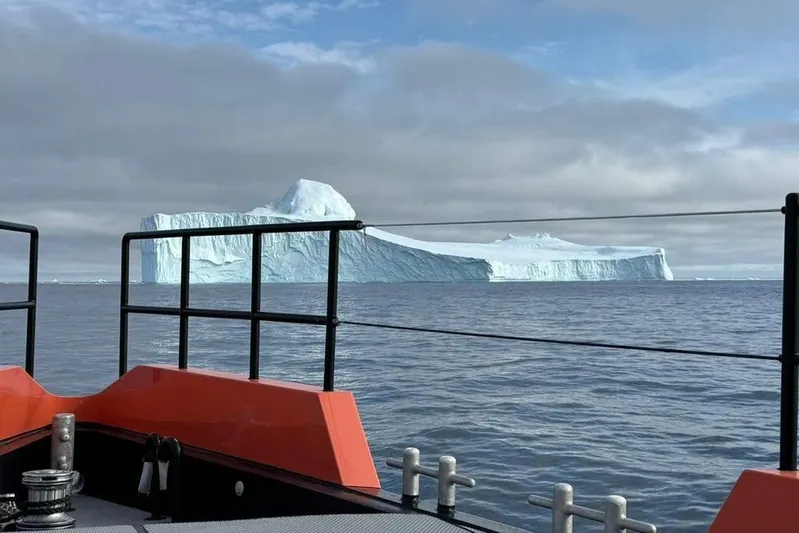 Vanguard Yacht Photos Pics Naval Yachts XPM 78 (2023) views massive iceberg on open sea.