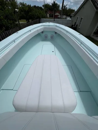  Yacht Photos Pics 2024 Contender 35 ST boat interior with white seating and light blue deck.