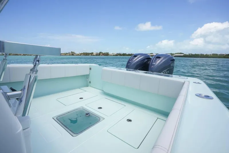  Yacht Photos Pics 2024 Contender 35 ST boat with dual engines on calm water.