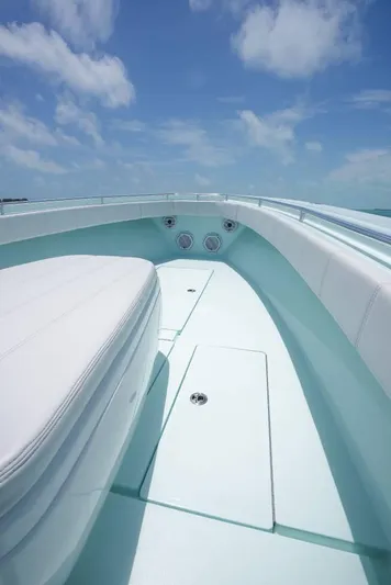  Yacht Photos Pics 2024 Contender 35 ST boat deck under clear blue sky.