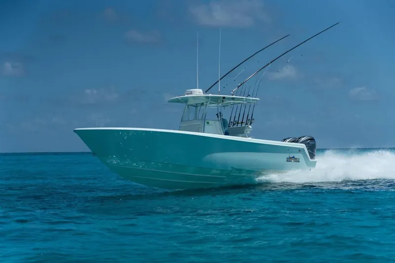  Yacht Photos Pics 2024 Contender 35 ST boat cruising on clear blue ocean waters.