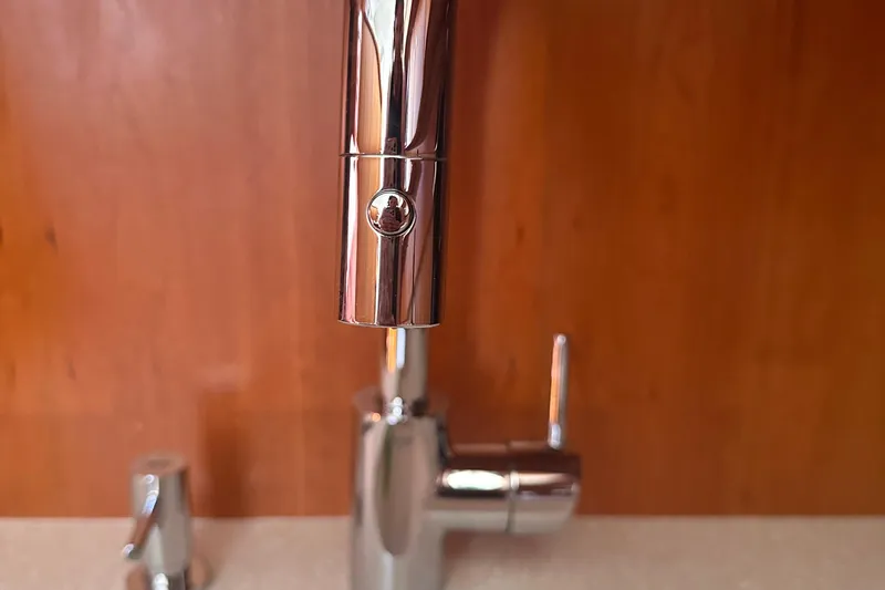 Double Eagle Yacht Photos Pics Chrome faucet in a 2004 Silverton 42 Convertible yacht kitchen.