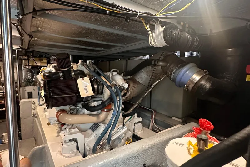 Double Eagle Yacht Photos Pics Engine room of a 2004 Silverton 42 Convertible yacht, showcasing detailed mechanical components.