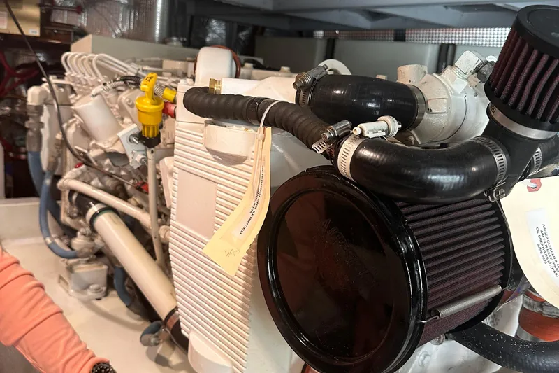 Double Eagle Yacht Photos Pics Engine compartment of a 2004 Silverton 42 Convertible boat, showcasing detailed components.