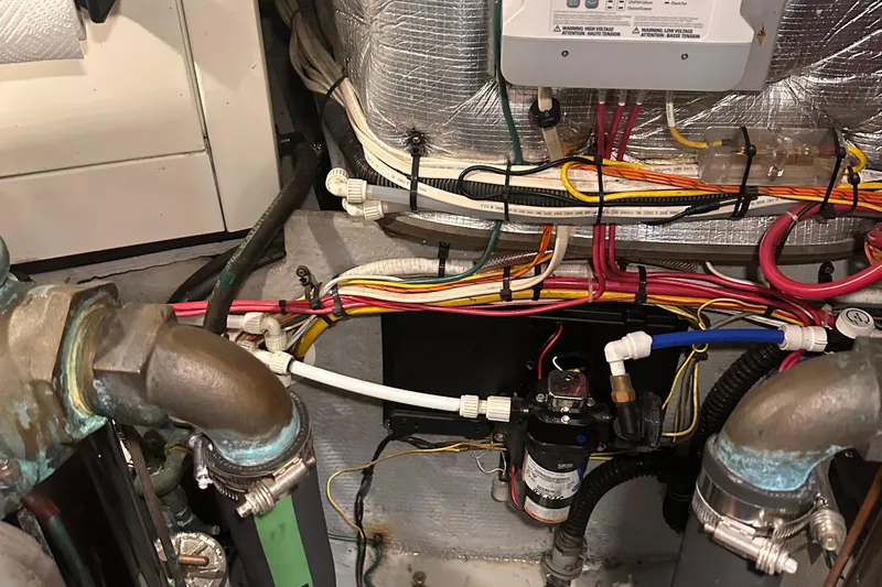 Double Eagle Yacht Photos Pics Engine room wiring and plumbing of a 2004 Silverton 42 Convertible boat.