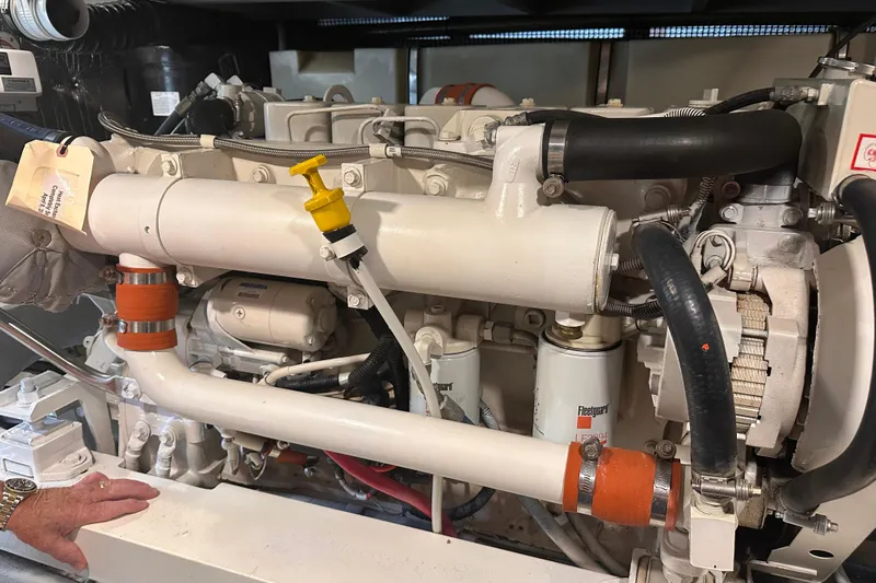 Double Eagle Yacht Photos Pics Engine compartment of a 2004 Silverton 42 Convertible yacht, showcasing mechanical components.