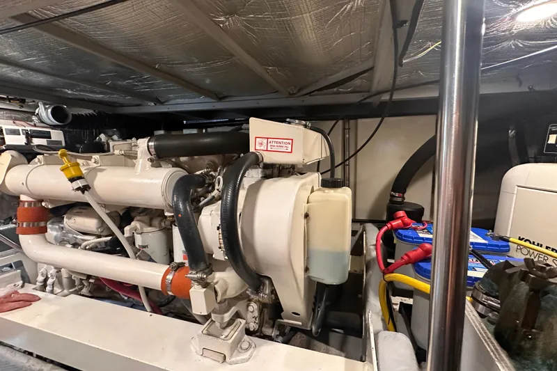 Double Eagle Yacht Photos Pics Engine room of a 2004 Silverton 42 Convertible yacht, showcasing machinery and components.