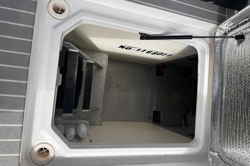 Double Eagle Yacht Photos Pics Hatch opening on a 2004 Silverton 42 Convertible boat, showing interior steps and storage.