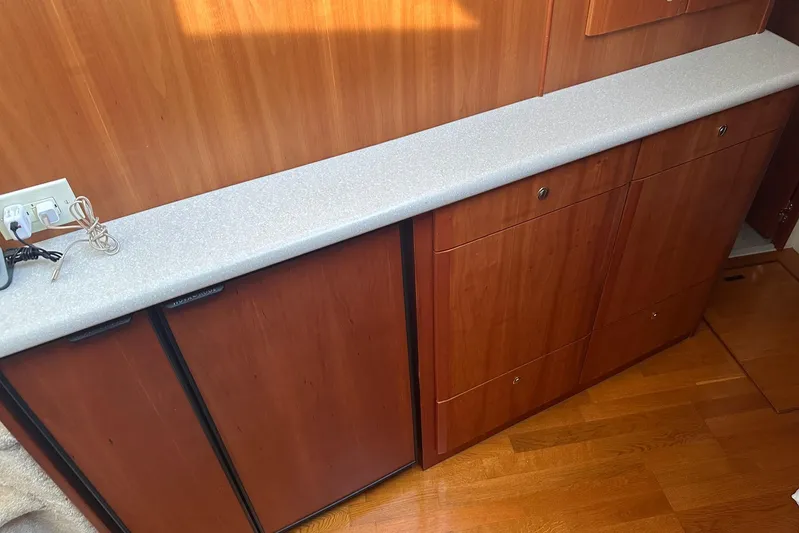 Double Eagle Yacht Photos Pics 2005 Silverton 42 Convertible yacht interior with wooden cabinets and countertop.