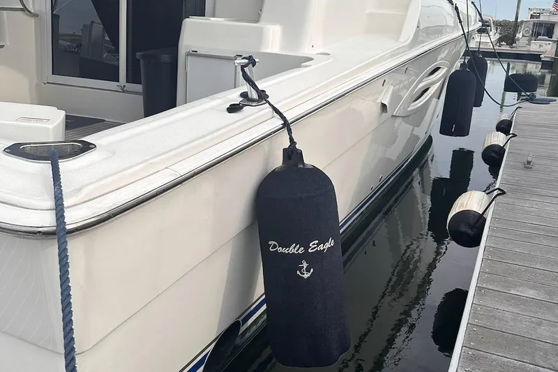 Double Eagle Yacht Photos Pics 2005 Silverton 42 Convertible yacht docked with fenders, named "Double Eagle."