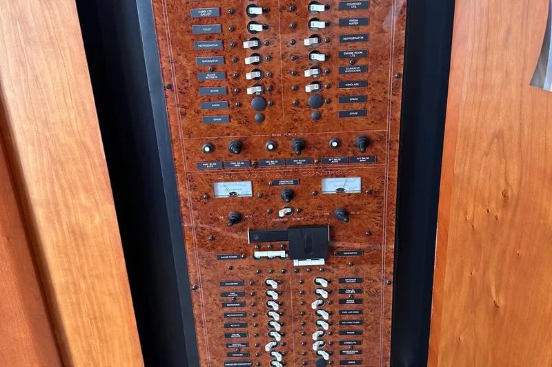 Double Eagle Yacht Photos Pics Control panel of a 2005 Silverton 42 Convertible yacht with various switches and dials.