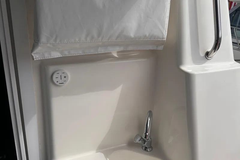 Double Eagle Yacht Photos Pics Interior detail of a 2005 Silverton 42 Convertible yacht, featuring a control panel and faucet.