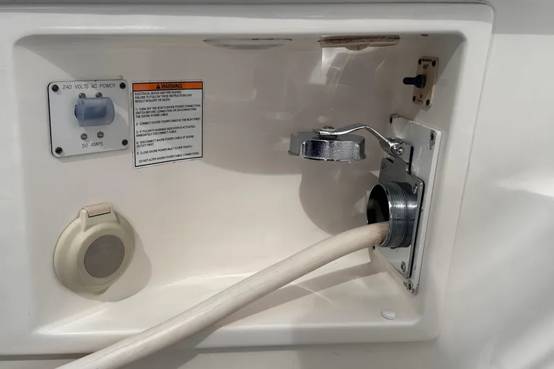 Double Eagle Yacht Photos Pics 2005 Silverton 42 Convertible boat power connection panel with 240 volts AC, 50 amps.