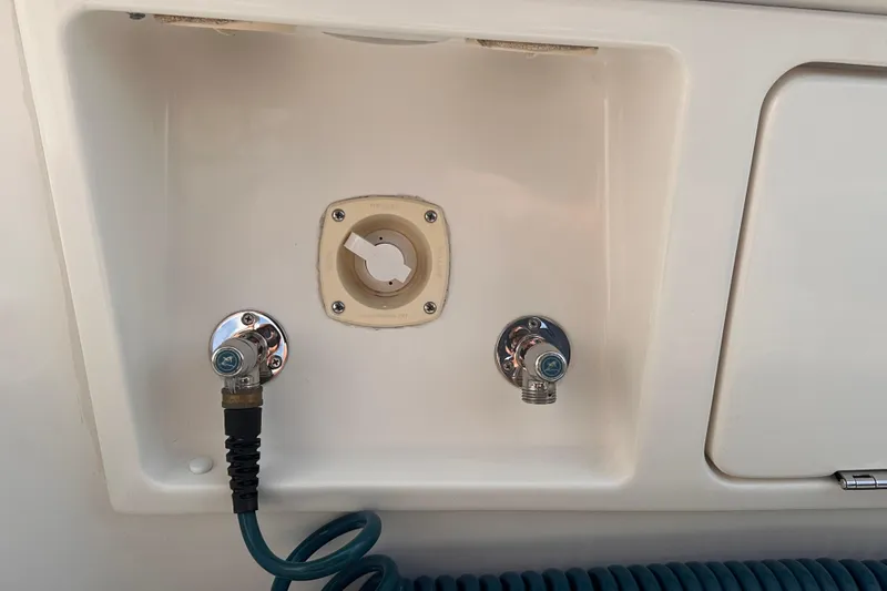 Double Eagle Yacht Photos Pics 2005 Silverton 42 Convertible boat utility connections with hose and fittings.