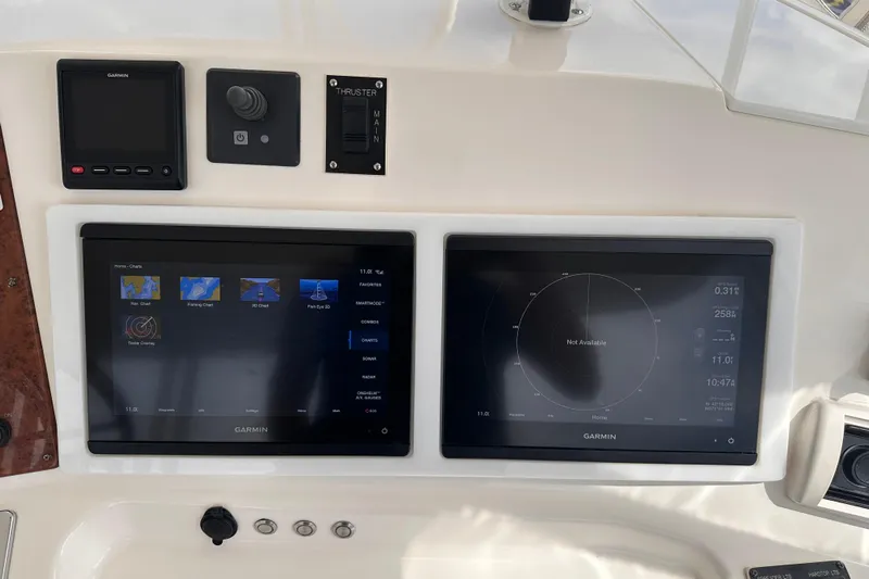Double Eagle Yacht Photos Pics Garmin navigation screens on 2005 Silverton 42 Convertible yacht dashboard.
