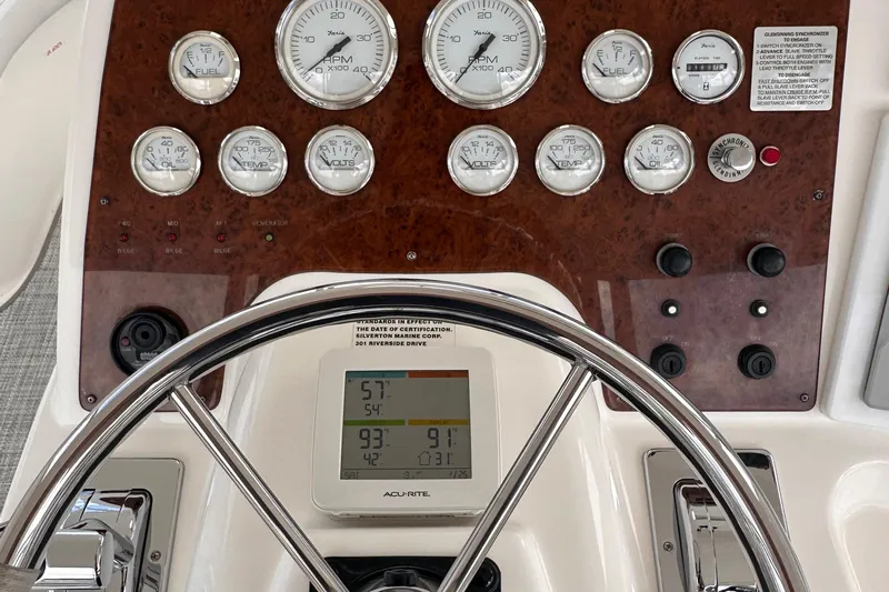 Double Eagle Yacht Photos Pics Dashboard of a 2005 Silverton 42 Convertible boat with gauges and controls.