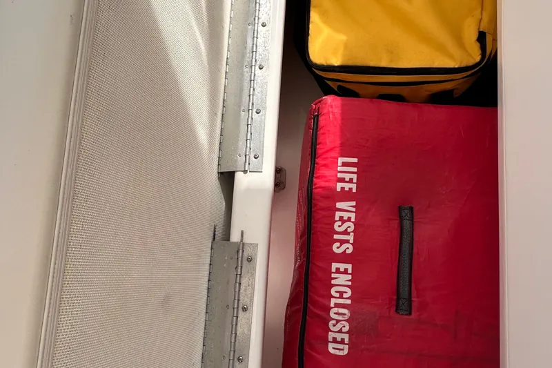 Double Eagle Yacht Photos Pics Storage compartment on a 2005 Silverton 42 Convertible with life vests enclosed.