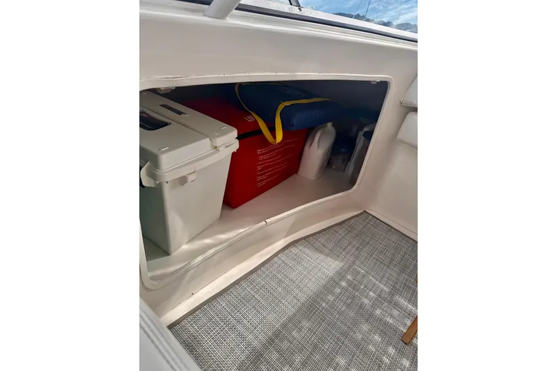 Double Eagle Yacht Photos Pics Storage compartment on 2005 Silverton 42 Convertible boat with cooler and supplies.