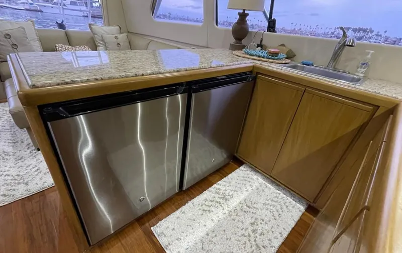 True Grit Yacht Photos Pics Interior of a 1995 Bertram Convertible yacht with modern kitchen amenities.