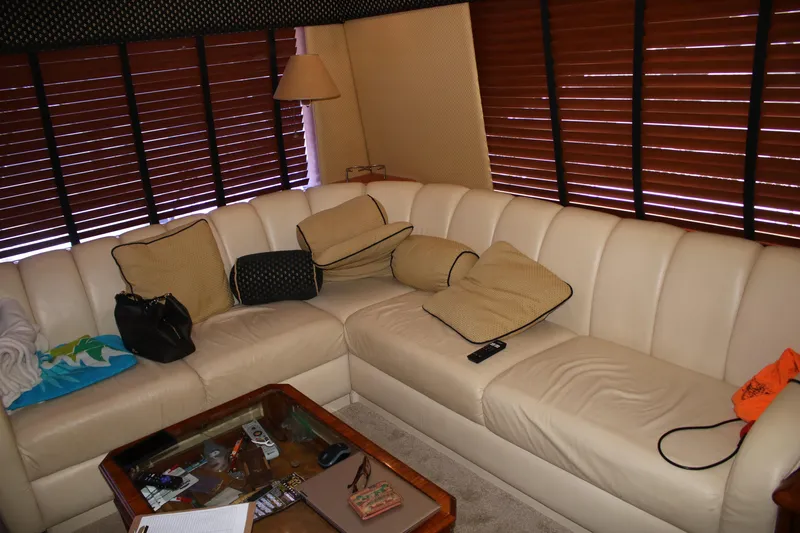 Sweetemocian Yacht Photos Pics Luxurious 1999 Ocean Yachts interior with cream leather sofa and wooden blinds.