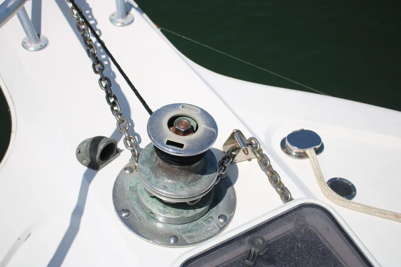 Sweetemocian Yacht Photos Pics Anchor winch on 1999 Ocean Yachts model, showcasing deck details and chain mechanism.