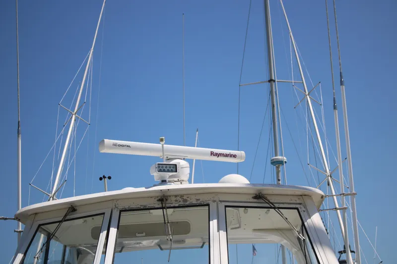 Sweetemocian Yacht Photos Pics 1999 Ocean Yachts model with Raymarine radar against clear blue sky.