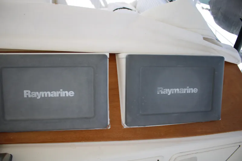 Sweetemocian Yacht Photos Pics Raymarine equipment on 1999 Ocean Yachts model, featuring dual displays on wooden panel.