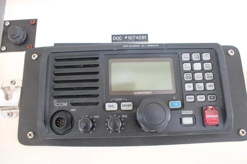 Sweetemocian Yacht Photos Pics VHF marine radio on 1999 Ocean Yachts model, featuring controls and distress button.