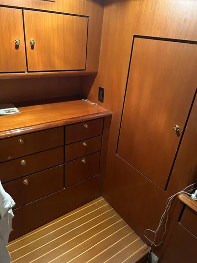 Sweetemocian Yacht Photos Pics 1999 Ocean Yachts interior with wooden cabinets and drawers, showcasing elegant craftsmanship.