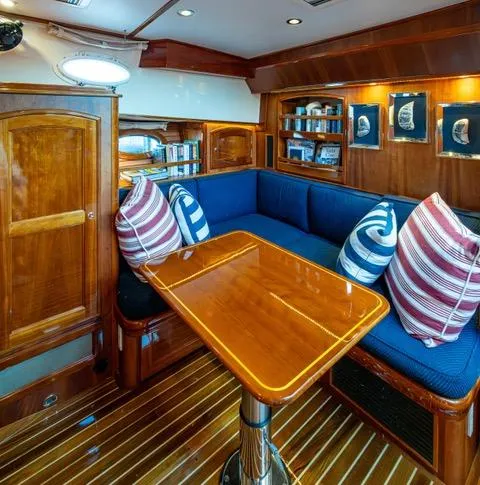 Virginia Yacht Photos Pics Luxurious 2013 Hinckley Talaria 48 Flybridge interior with elegant wood finish and cozy seating.