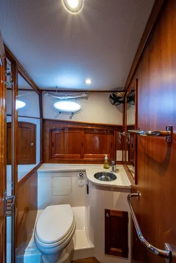 Virginia Yacht Photos Pics Luxurious 2013 Hinckley Talaria 48 Flybridge yacht bathroom with wood accents and modern fixtures.